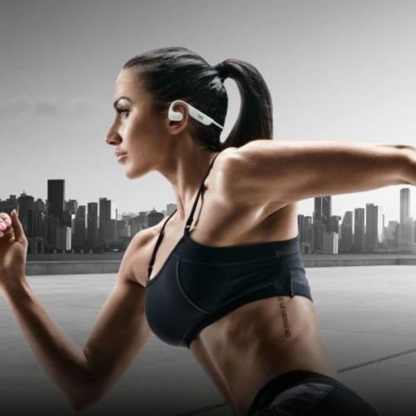 Athlete wearing T'nB ENERGY Air Open Ear headphones outdoors